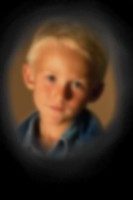 photo of a boy that is blurred in the center and the edges are completely blacked out due to loss of peripheral vision